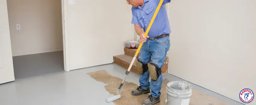 BCC - An old man painting a garage floor