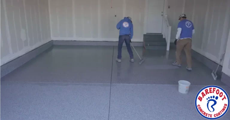 Two workers applying epoxy floor coating | BCC