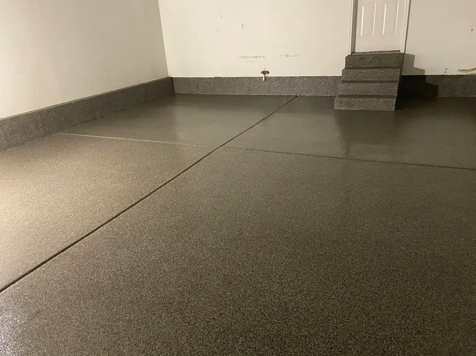 An after photo of a warehouse with professionally polished concrete floor and small steps.