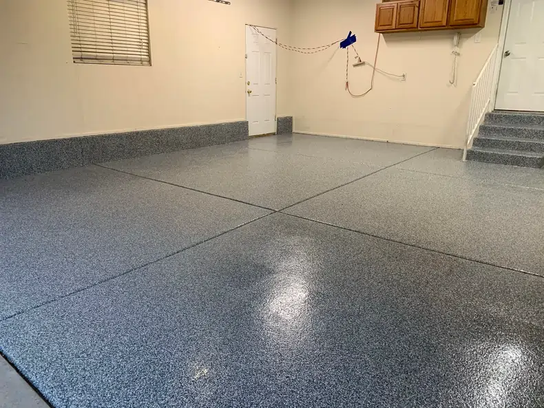 An after photo of a white room after its concrete floor was professionally coated and polished.