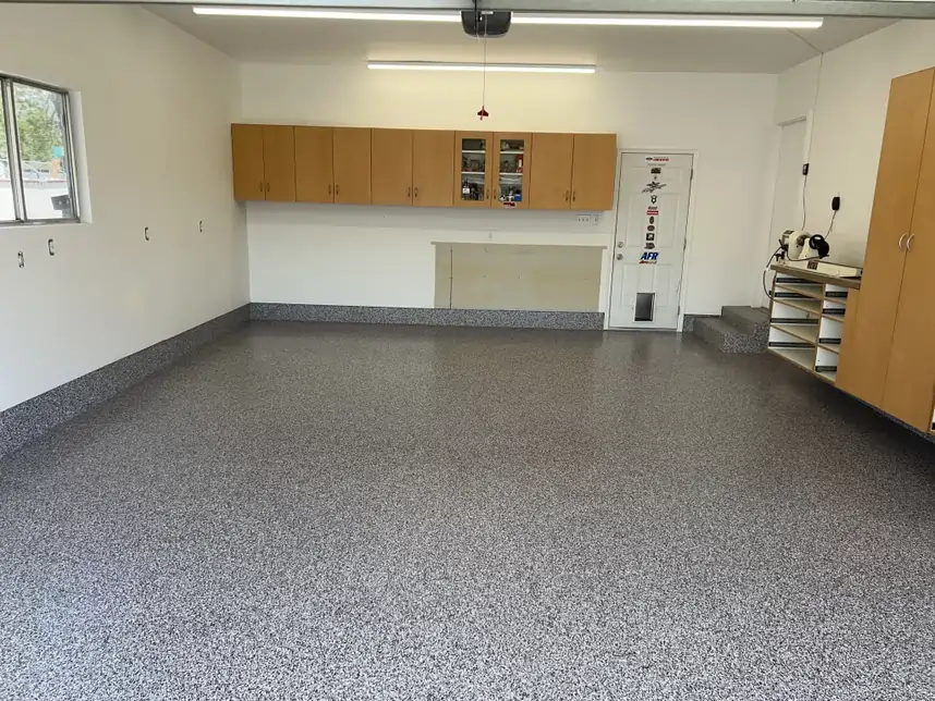 A white storage room with fully polished floors coated with polyaspartic coating.