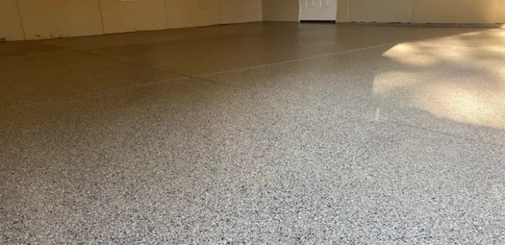 An empty room with a fully coated concrete floor.